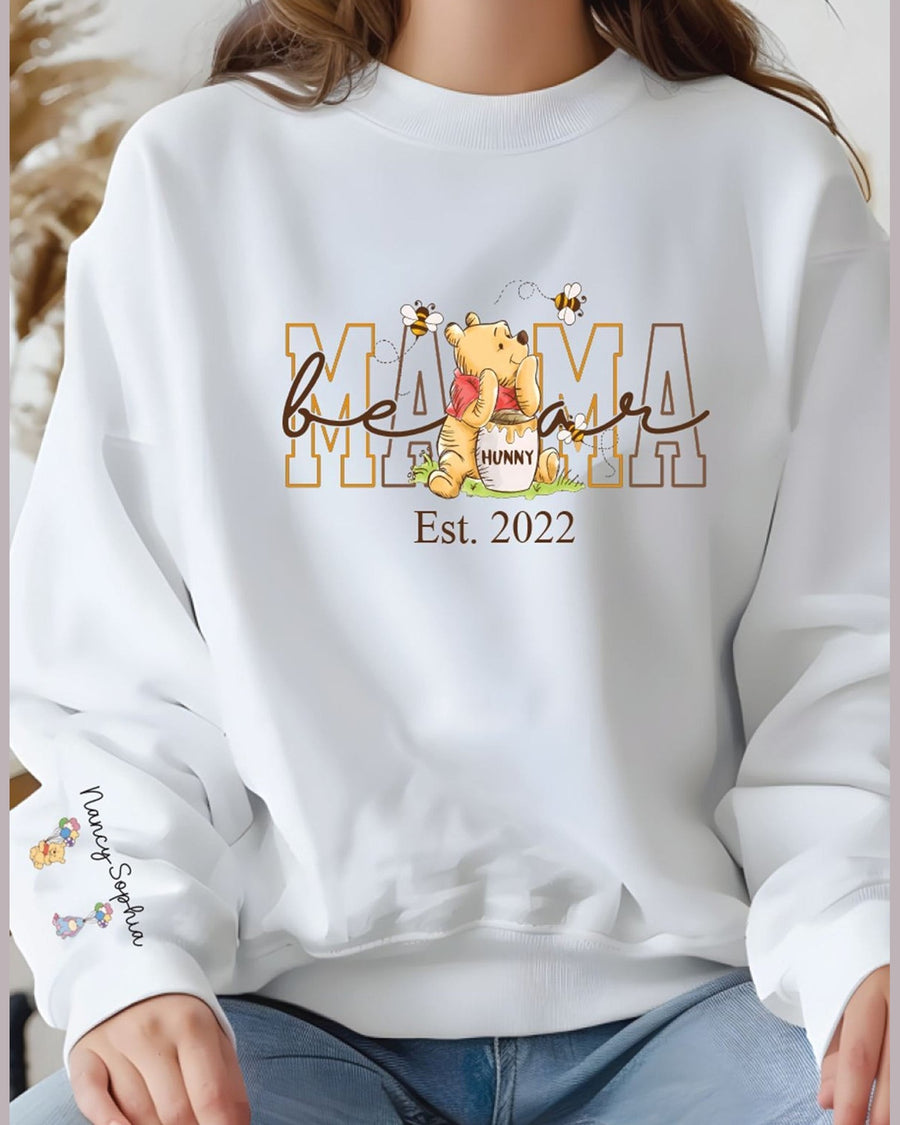 White fitted Mama crewneck sweatshirt featuring Winnie the Pooh design and child names on sleeve