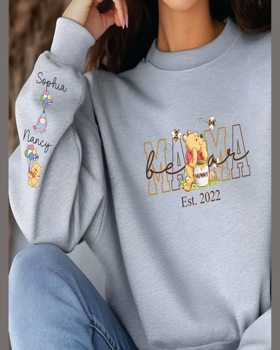 Light gray Mama crewneck sweatshirt worn by model with Winnie the Pooh and custom sleeve names