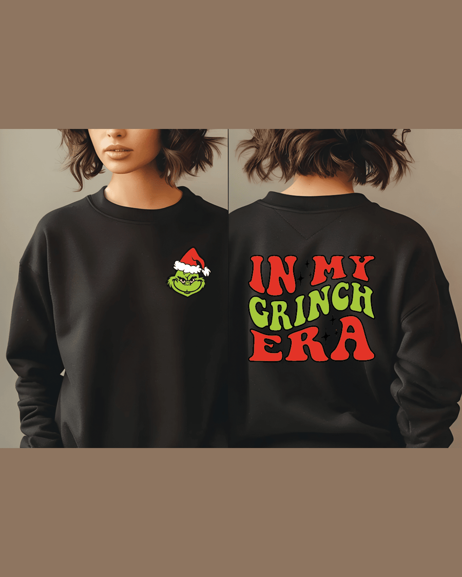 Black personalized holiday sweatshirt featuring Grinch logo and festive back print