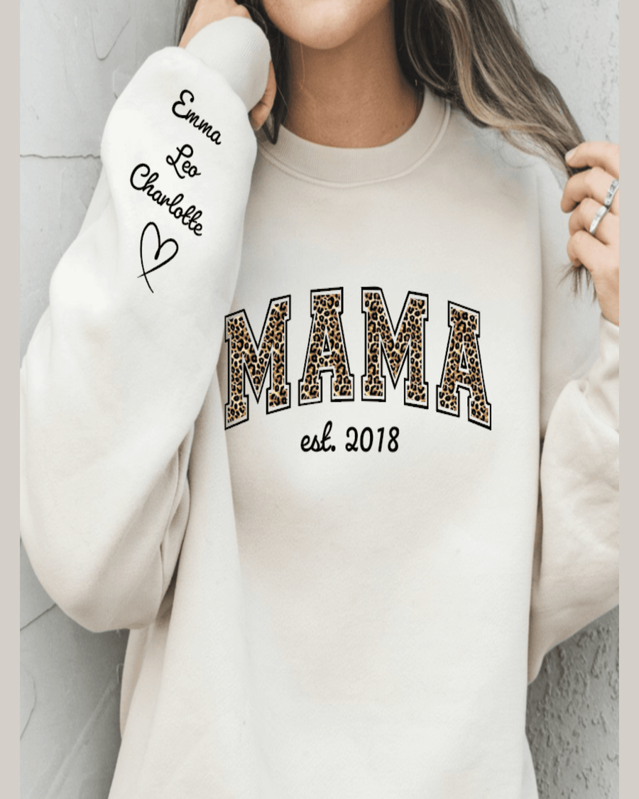 Cream oversized fit custom name sweatshirt with leopard print lettering and embroidered sleeve names