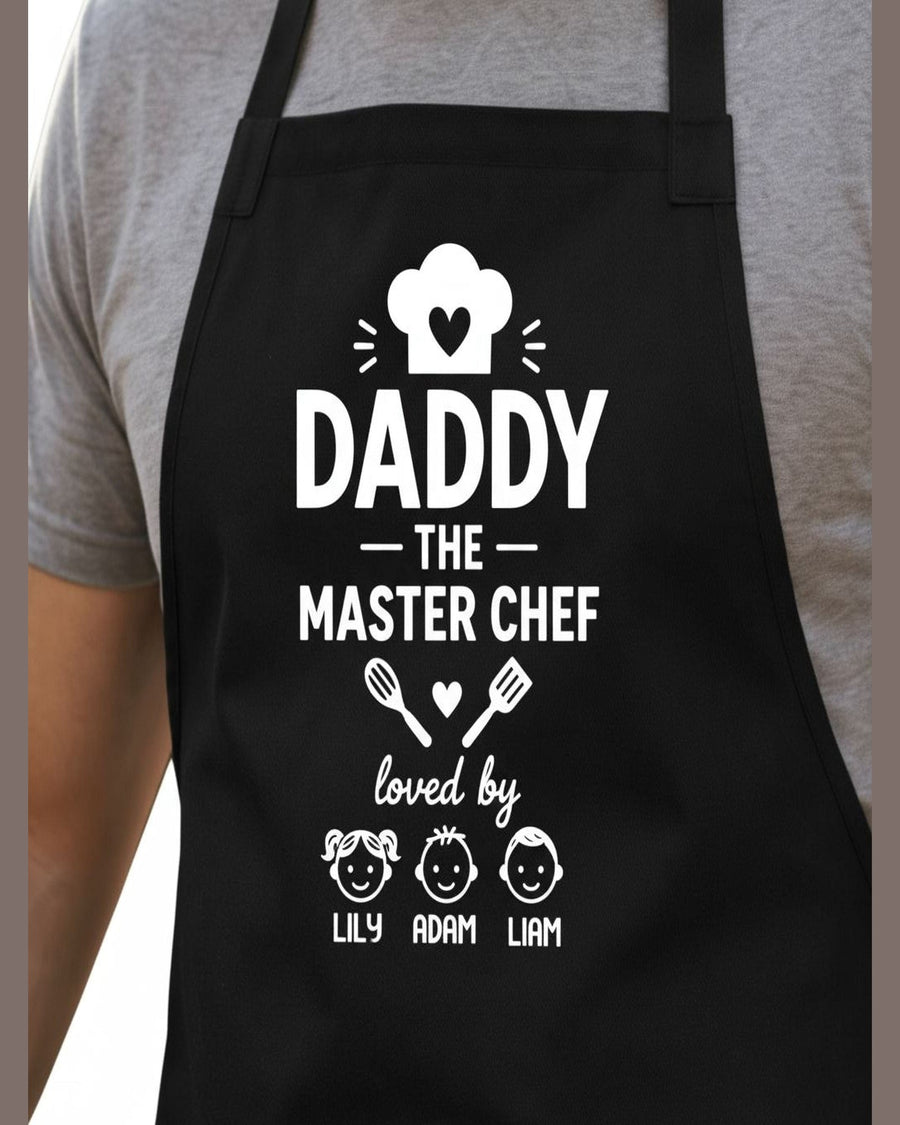 Close-up of black cotton BBQ apron featuring custom text and child name details for dads