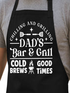 Dad’s Bar and Grill apron featuring funny BBQ typography design worn by man grilling outdoors in backyard.