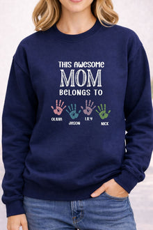 A woman wearing a navy blue sweatshirt with a message printed on it.
