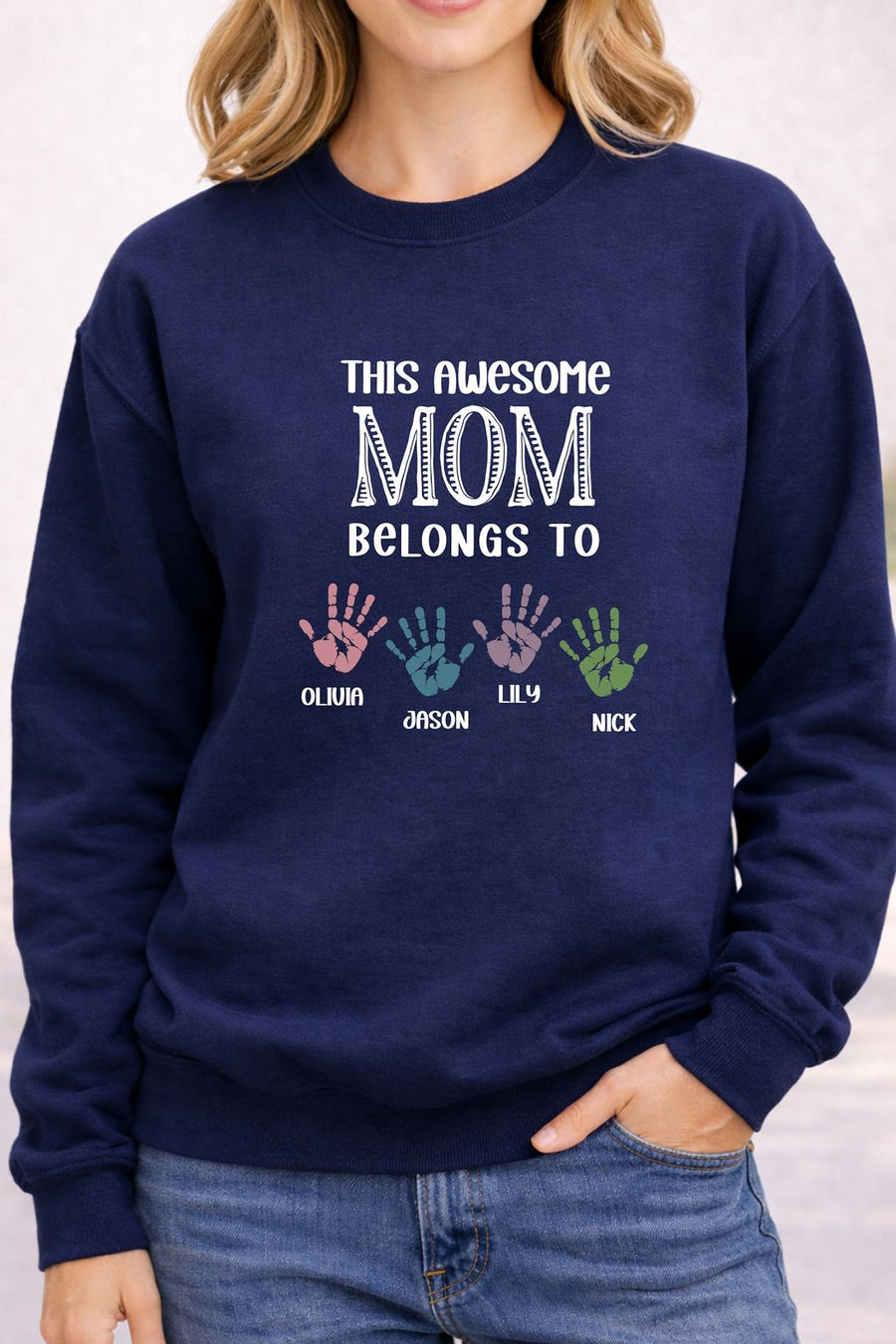 A woman wearing a navy blue sweatshirt with a message printed on it.