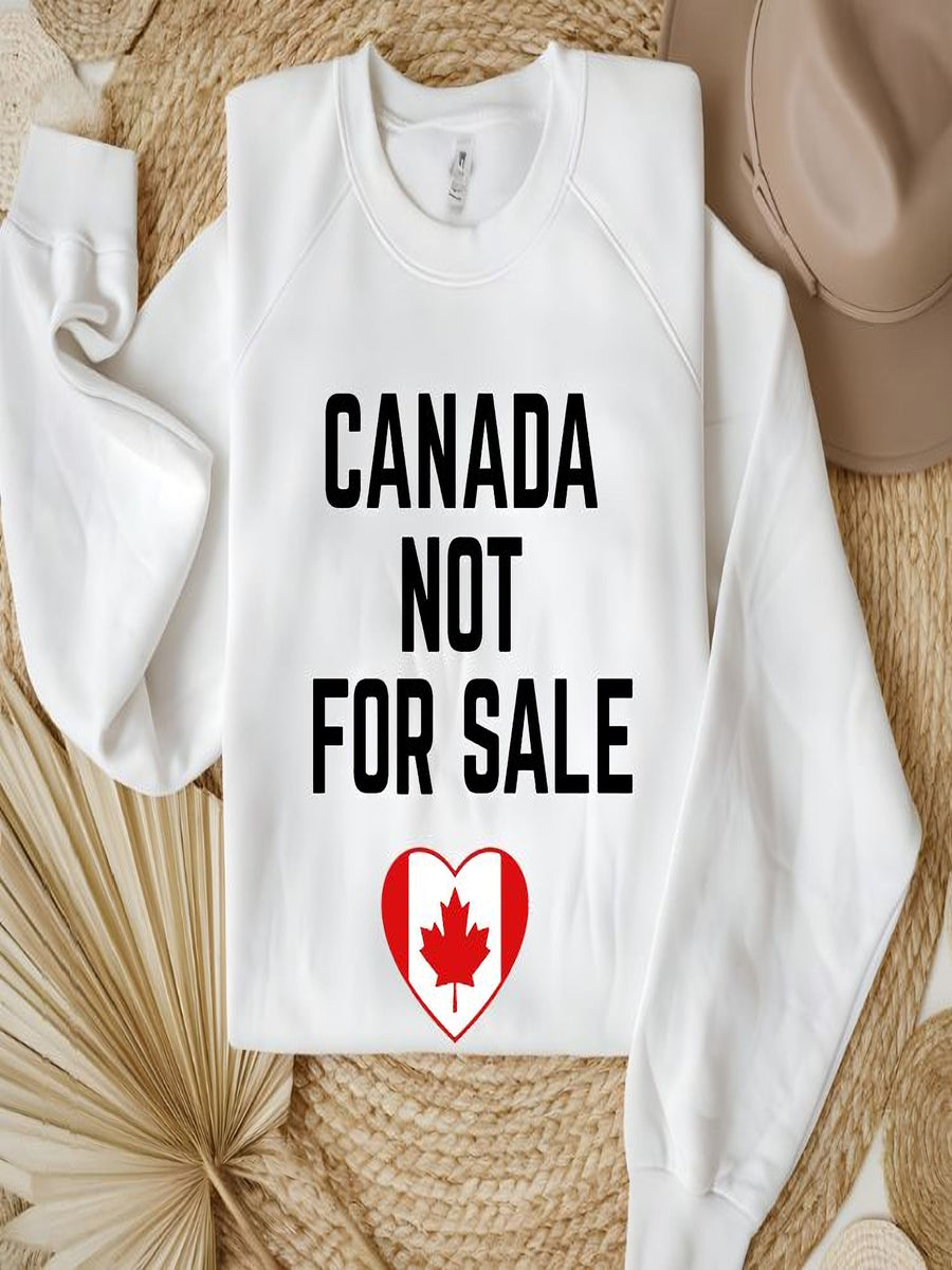 sweatshirt featuring the phrase Canada Not For Sale with a heart-shaped Canadian flag and maple leaf graphic representing Canadian pride.