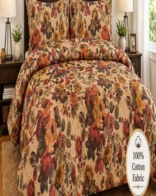 a bedroom with a floral-patterned bedspread and matching pillows, along with two lamps on either side of the bed.