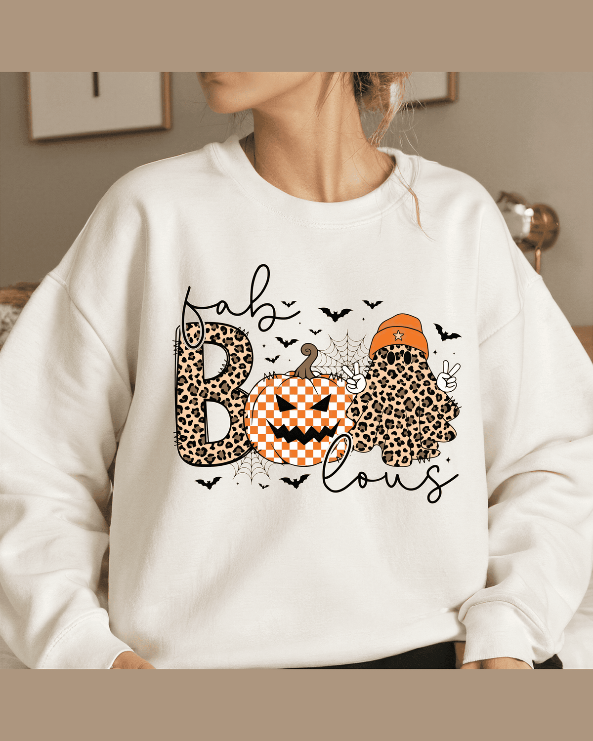 Woman modeling white crewneck sweatshirt with Fab Boo Lous Halloween graphic design