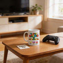 A white mug with a colorful design sits on a wooden coffee table, accompanied by a black game controller and a note that reads "Father's Day".