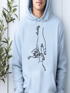 A person wearing a light blue hoodie with a hand drawing and the words "daddy" and " Tyler" printed on it.