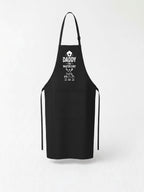 personalized Daddy The Master Chef BBQ apron with custom kids names worn by dad grilling outdoors.