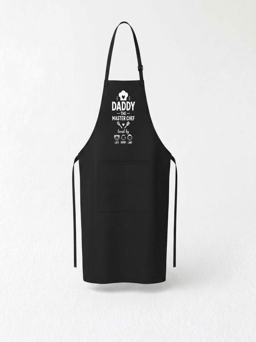personalized Daddy The Master Chef BBQ apron with custom kids names worn by dad grilling outdoors.