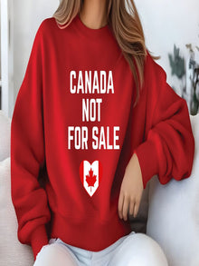 sweatshirt featuring the phrase Canada Not For Sale with a heart-shaped Canadian flag and maple leaf graphic representing Canadian pride.