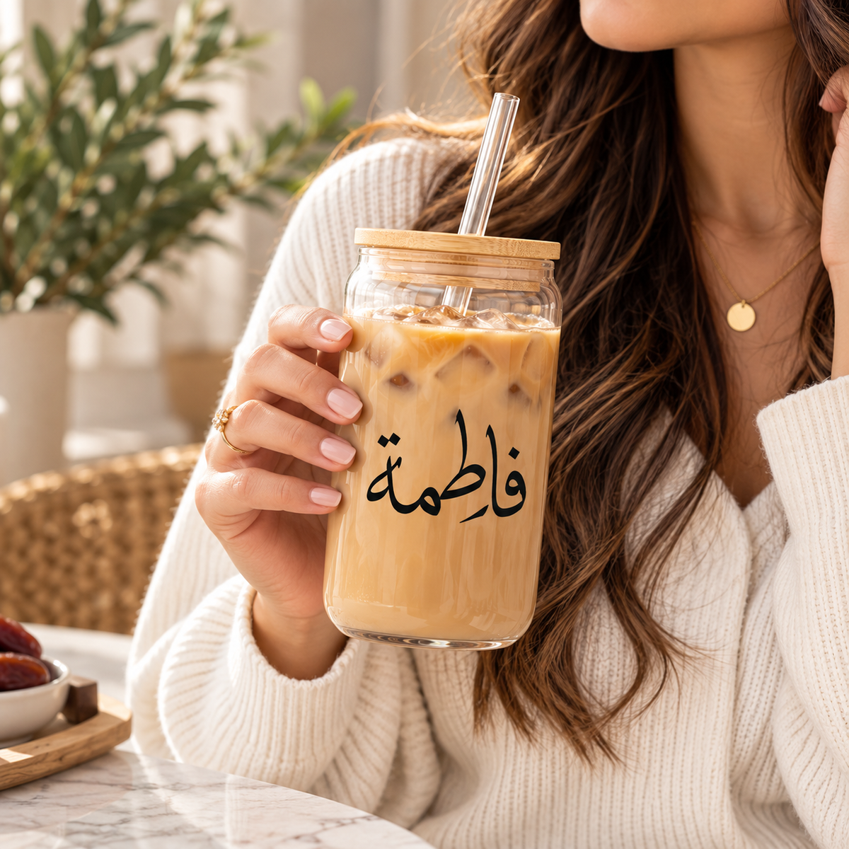 Personalized Arabic Name Glass Tumbler – woman holding glass tumbler with Arabic name Fatima and iced coffee