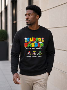 Super Daddio personalized sweatshirt featuring retro gamer-inspired colorful artwork and custom kids names worn by male model outdoors.