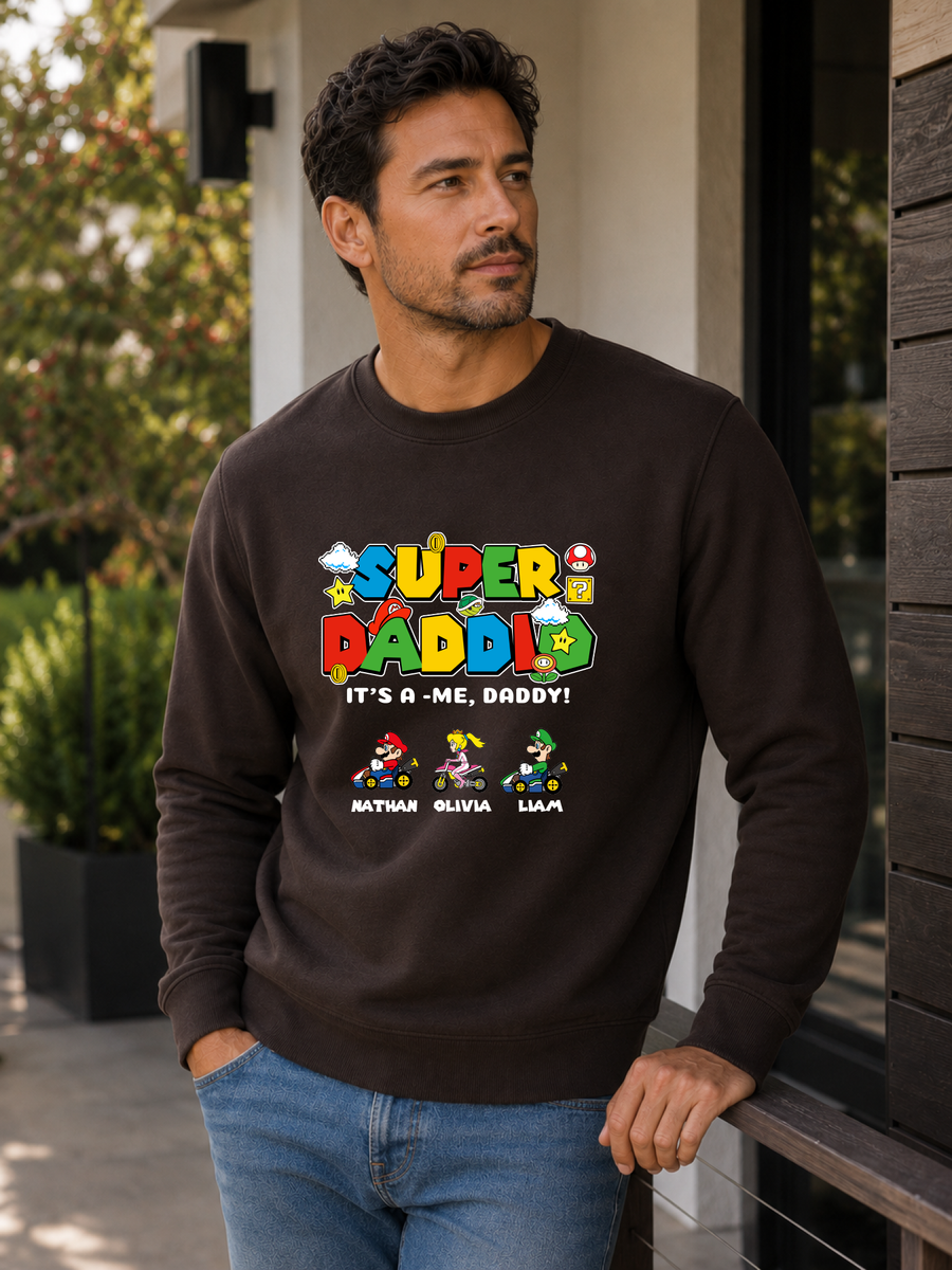 Super Daddio personalized sweatshirt featuring retro gamer-inspired colorful artwork and custom kids names worn by male model outdoors.