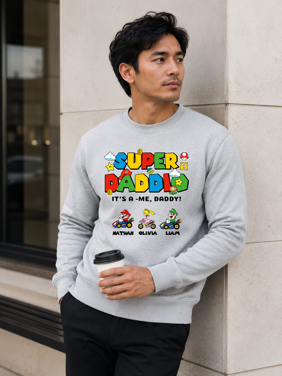 Super Daddio personalized sweatshirt featuring retro gamer-inspired colorful artwork and custom kids names worn by male model outdoors.
