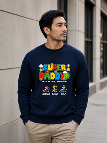 Super Daddio personalized sweatshirt featuring retro gamer-inspired colorful artwork and custom kids names worn by male model outdoors.