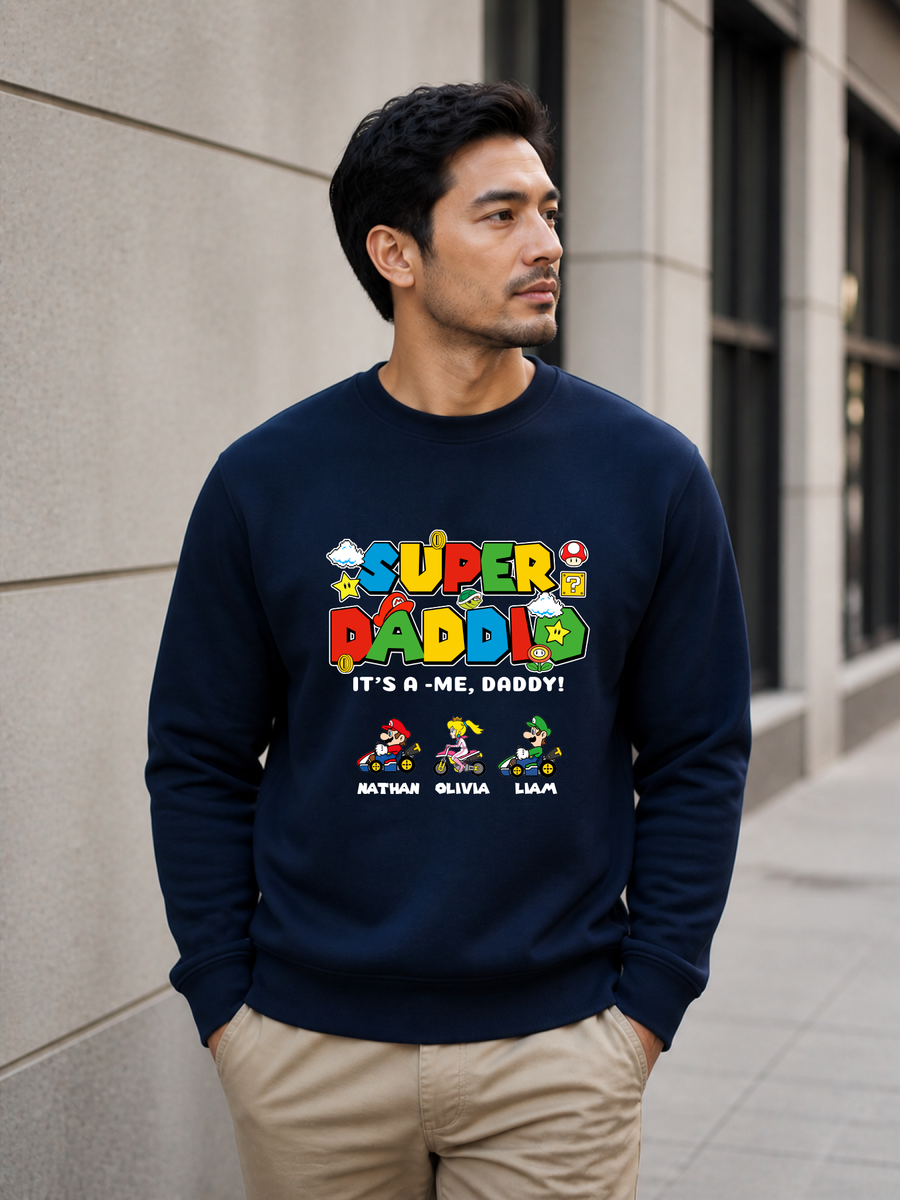 Super Daddio personalized sweatshirt featuring retro gamer-inspired colorful artwork and custom kids names worn by male model outdoors.