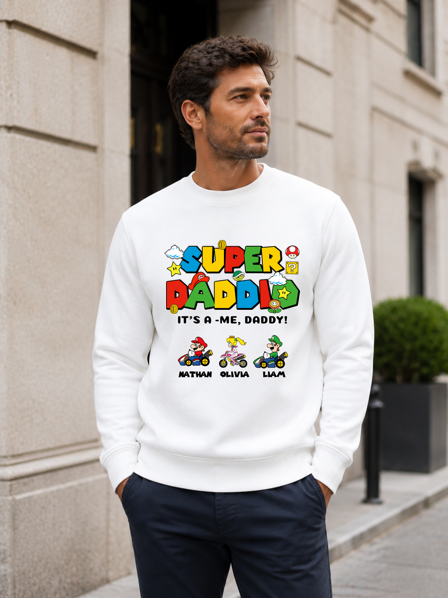 Super Daddio personalized sweatshirt featuring retro gamer-inspired colorful artwork and custom kids names worn by male model outdoors.