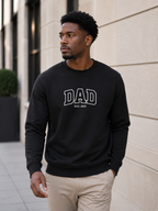 Man wearing a black sweatshirt with 'DAD EST. 2019' text