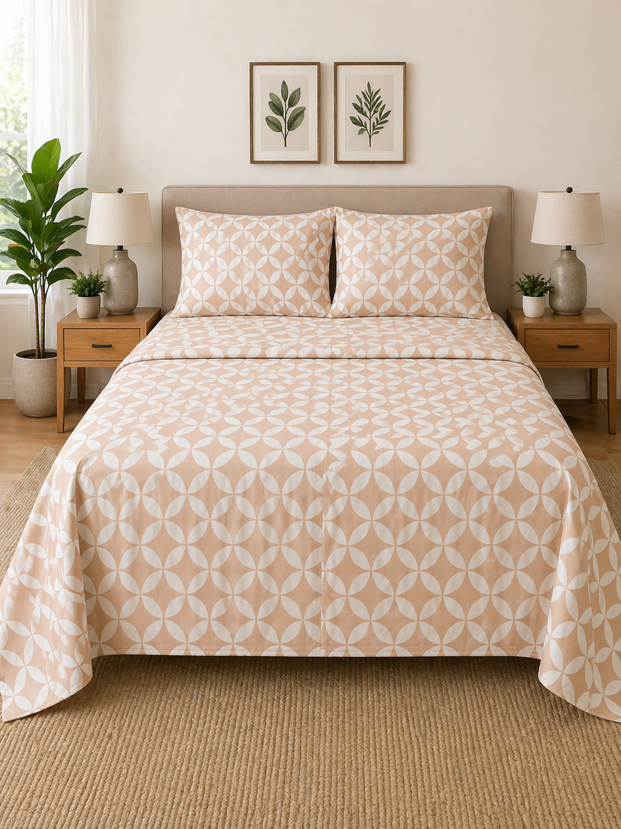Bedroom with a bed featuring a patterned comforter, nightstands, and wall art.