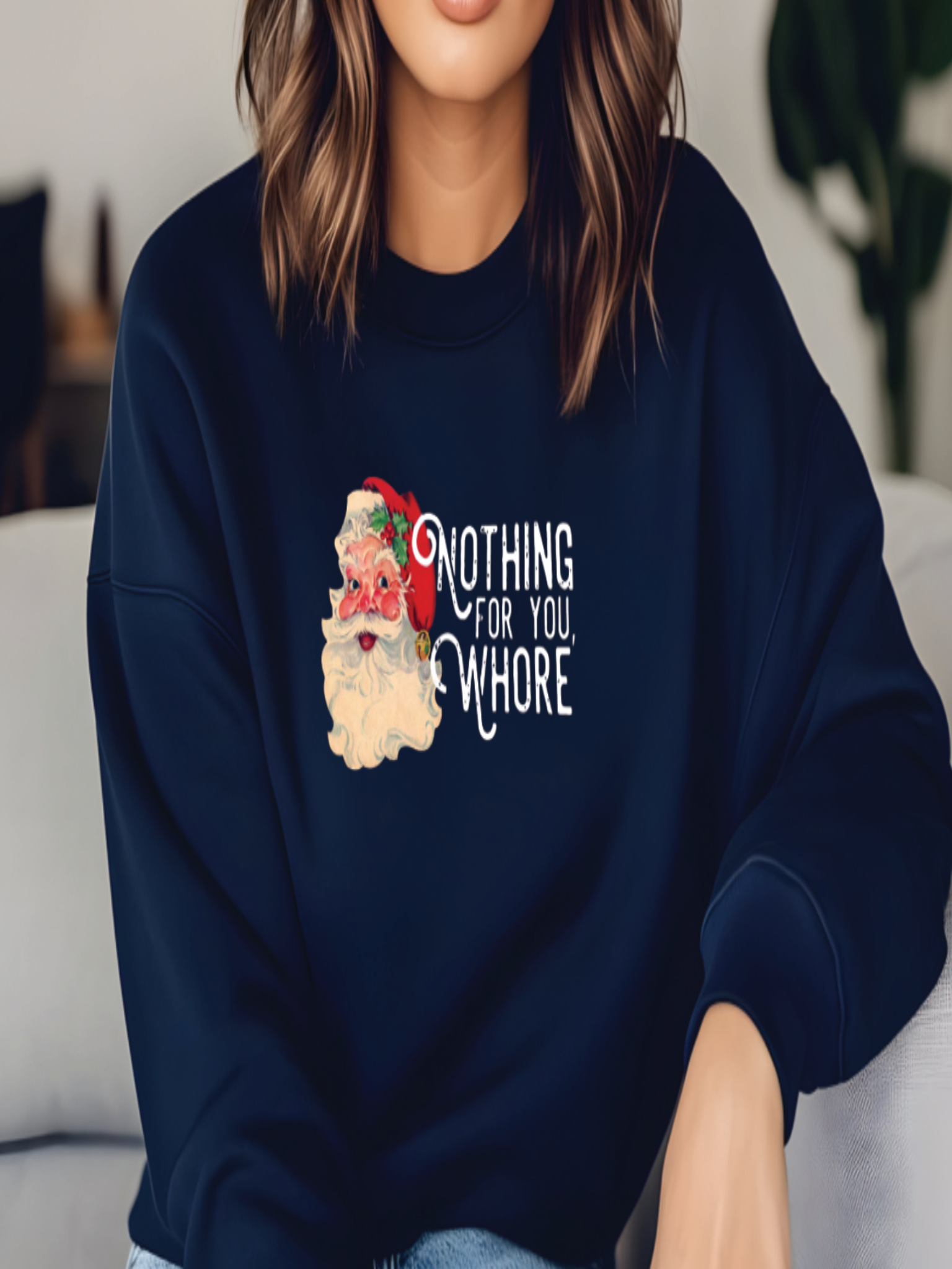 Person wearing a navy blue sweatshirt with a graphic and text