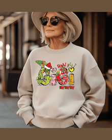 Cream custom holiday sweatshirt with Grinch graphic and personalized 'GIGI' name