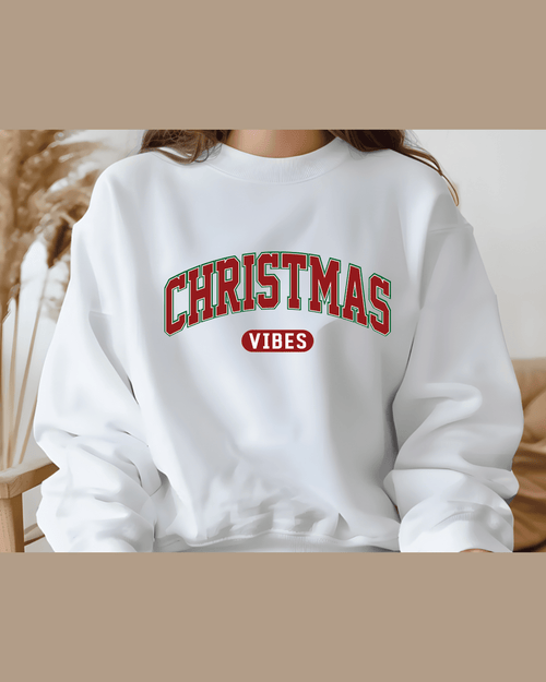 Custom white Christmas crewneck sweatshirt with red oval 'VIBES' logo for cozy winter wear