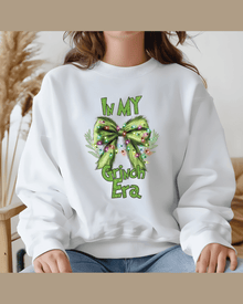 White kids holiday sweatshirt with personalized Grinch Era bow print for family matching
