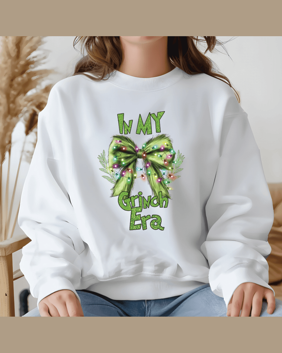 White kids holiday sweatshirt with personalized Grinch Era bow print for family matching