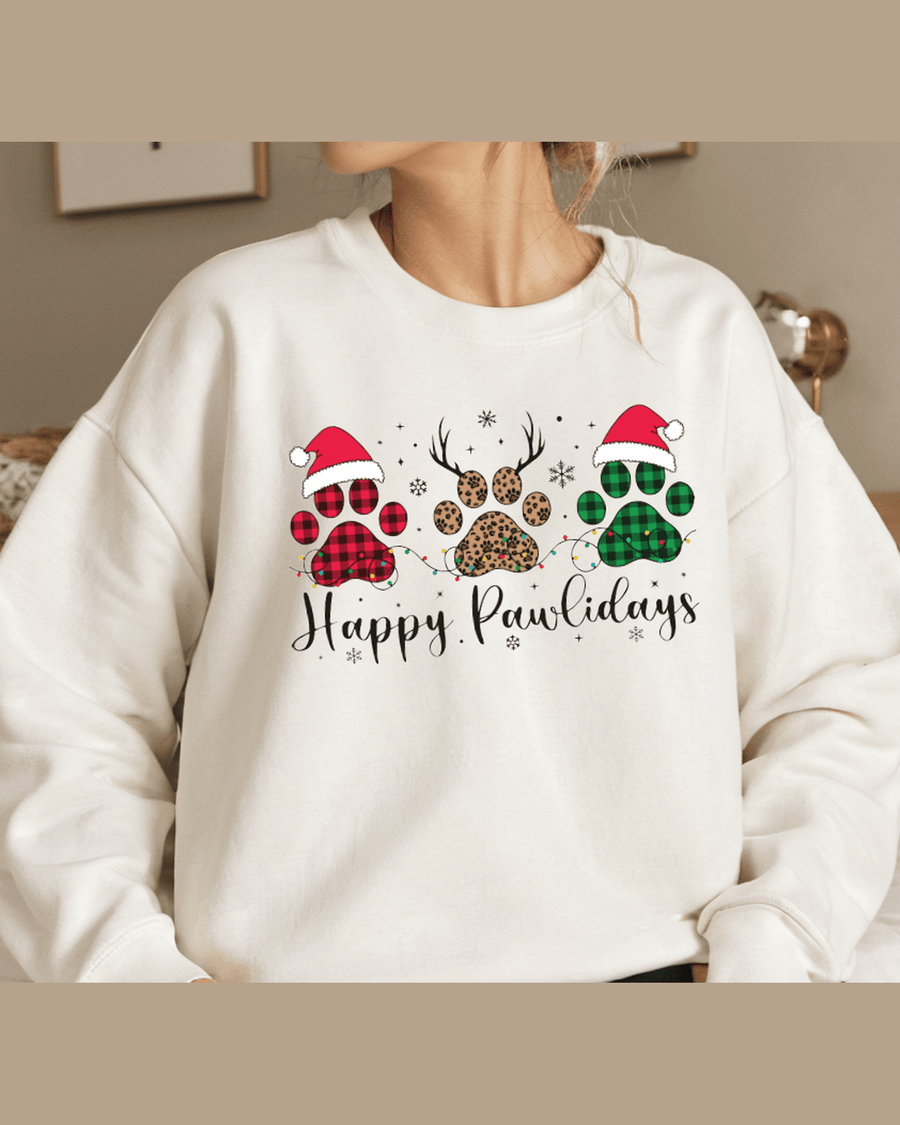 White personalized holiday sweatshirt featuring festive paw prints and string light details
