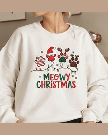 White custom Christmas hoodie with MEOWY CHRISTMAS paw print graphic and festive lights