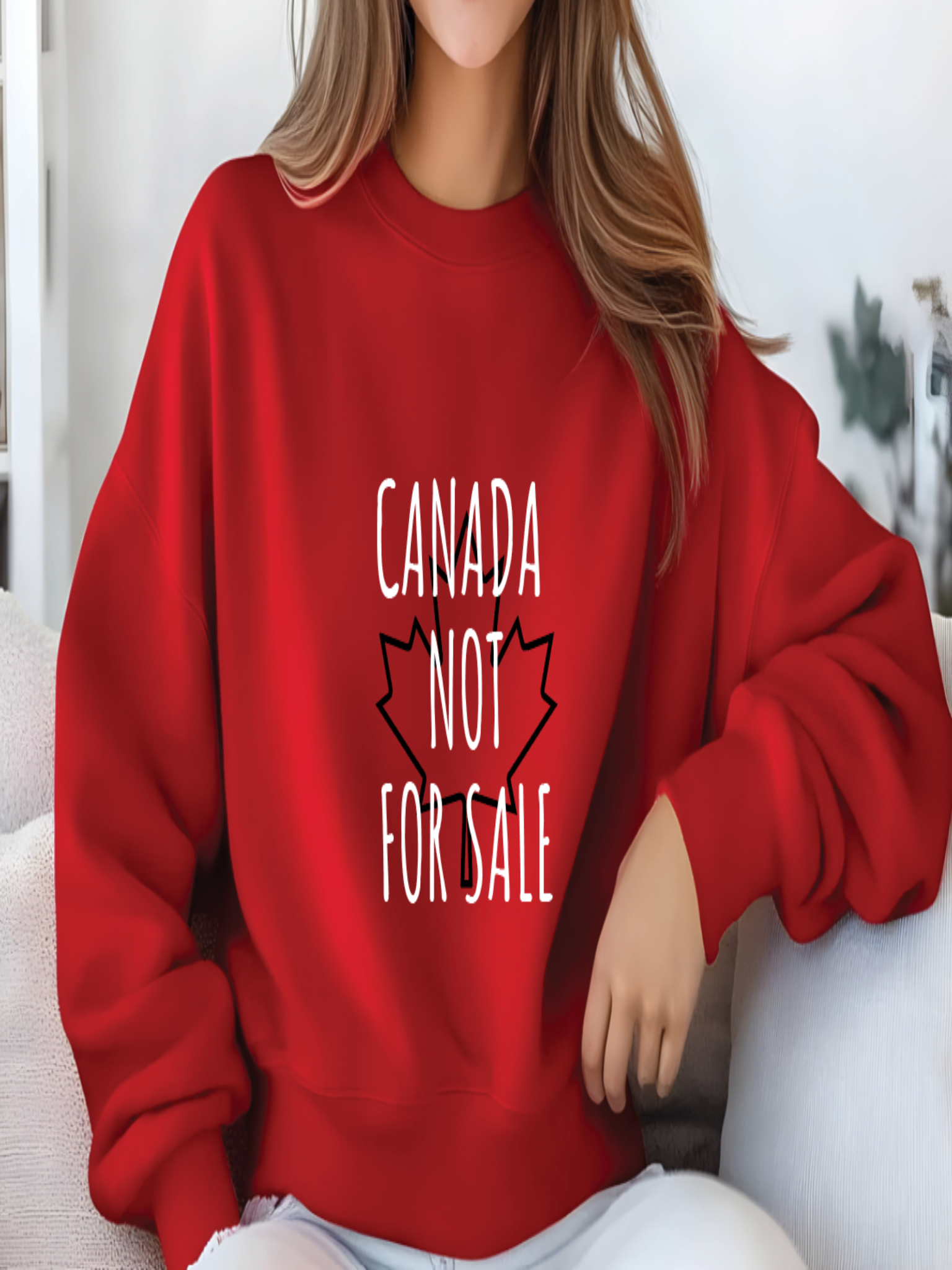 sweatshirt featuring the phrase Canada Not For Sale over a red maple leaf outline in a minimalist Canadian pride design.