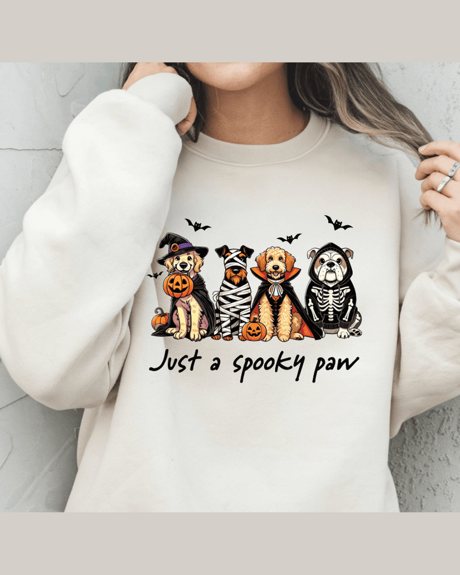 Cream custom graphic hoodie with Halloween dogs in costumes and 'Just a spooky paw' text
