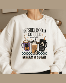 White personalized sweatshirt featuring Freshly Boo'd Coffee Halloween design on model