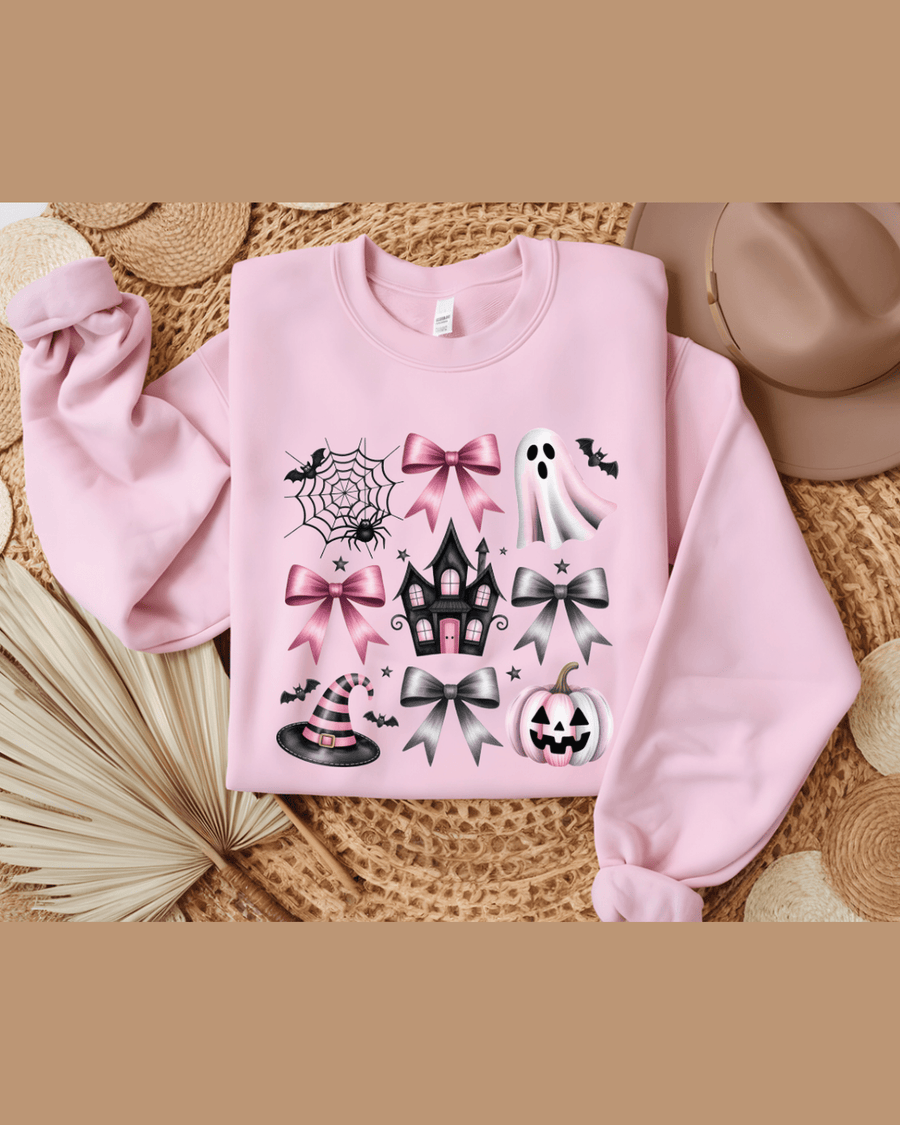 Pink crewneck custom name hoodie with Halloween graphics laid flat