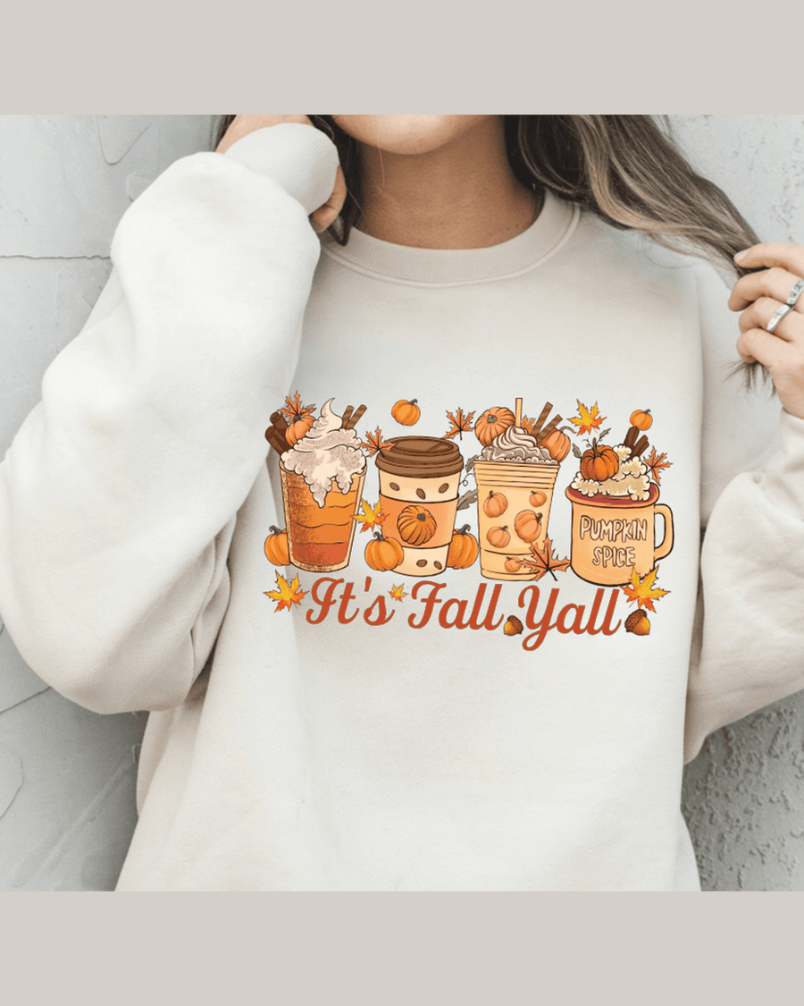 Cream unisex fit hoodie featuring cozy autumn drink graphics and It's Fall Yall text