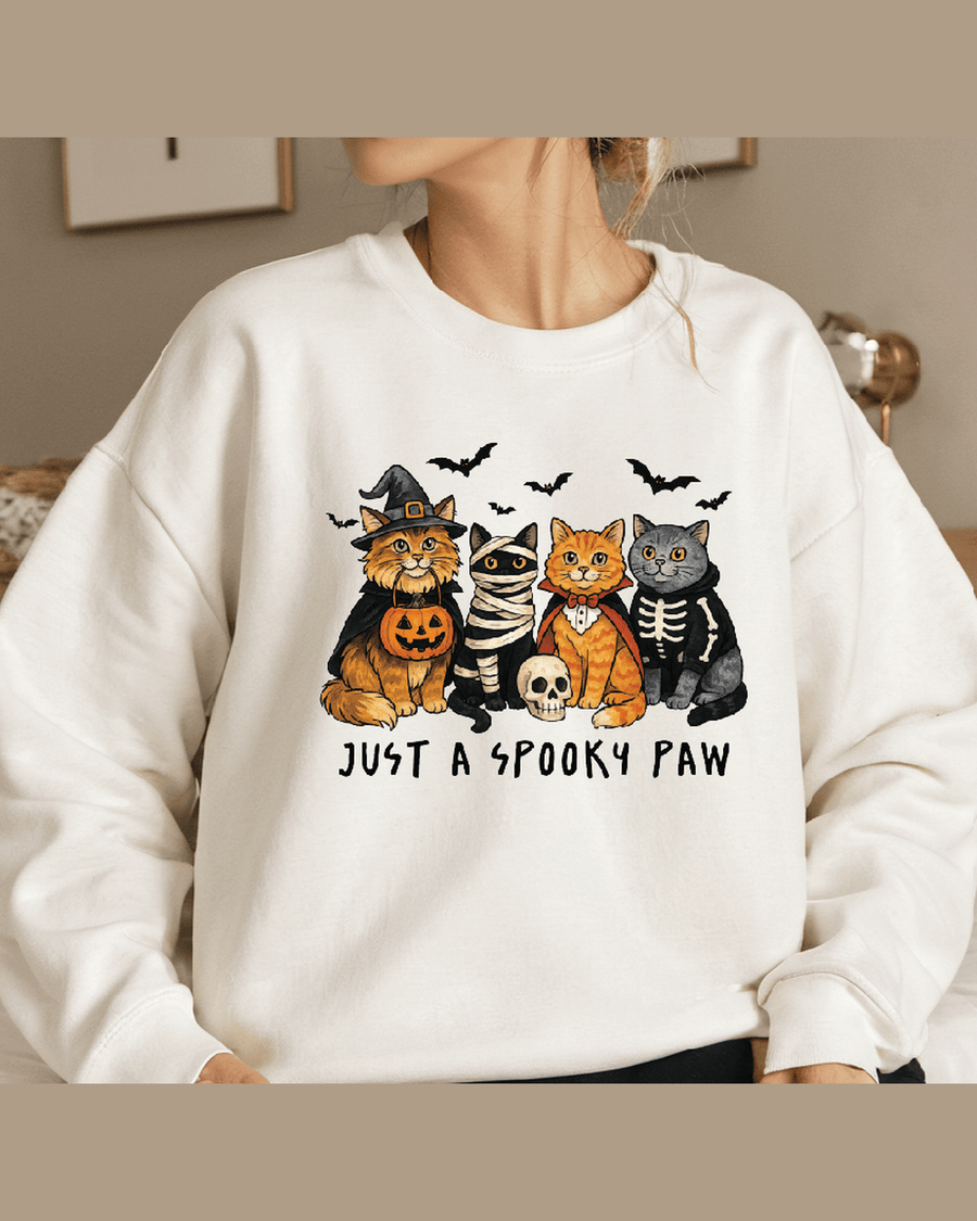 White personalized sweatshirt featuring spooky cat costumes on model