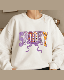 White personalized sweatshirt featuring Spooky Halloween lettering design