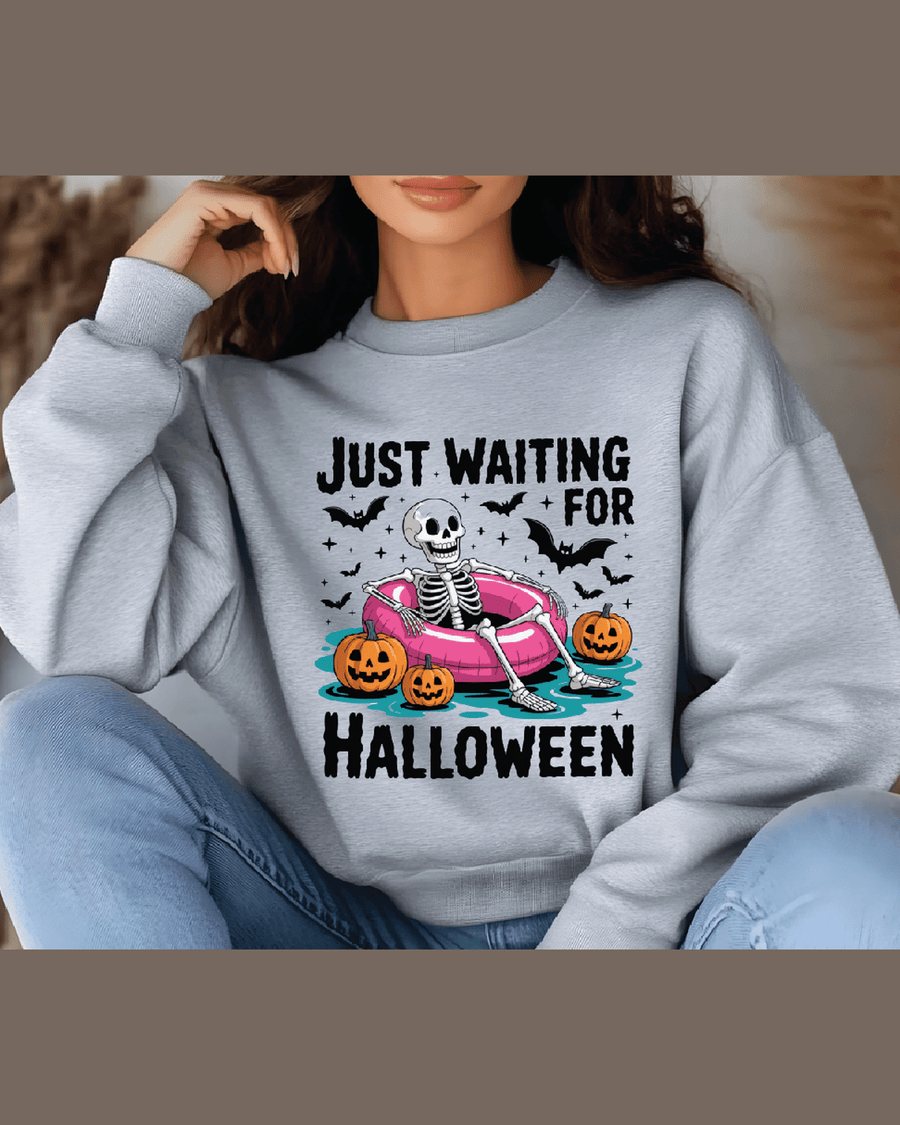 Heather gray unisex Halloween sweatshirt featuring skeleton in pink ring on relaxed fit