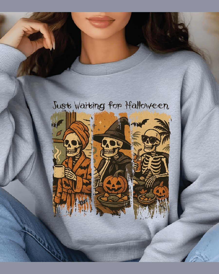 Heather gray unisex Halloween hoodie with distressed triptych skeleton design and script text