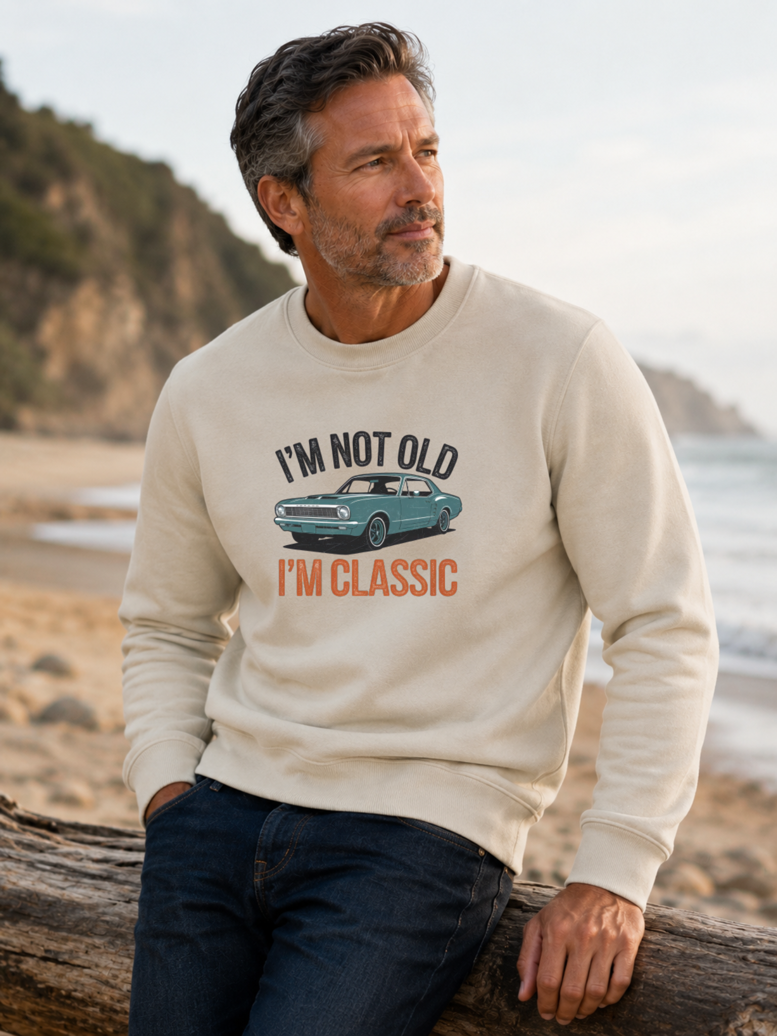 I'm Not Old I'm Classic sweatshirt featuring a vintage muscle car graphic and funny retro slogan worn by male model outdoors.