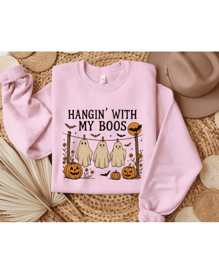 Pink crewneck sweatshirt flat lay with 'Hangin With My Boos' Halloween ghost print design