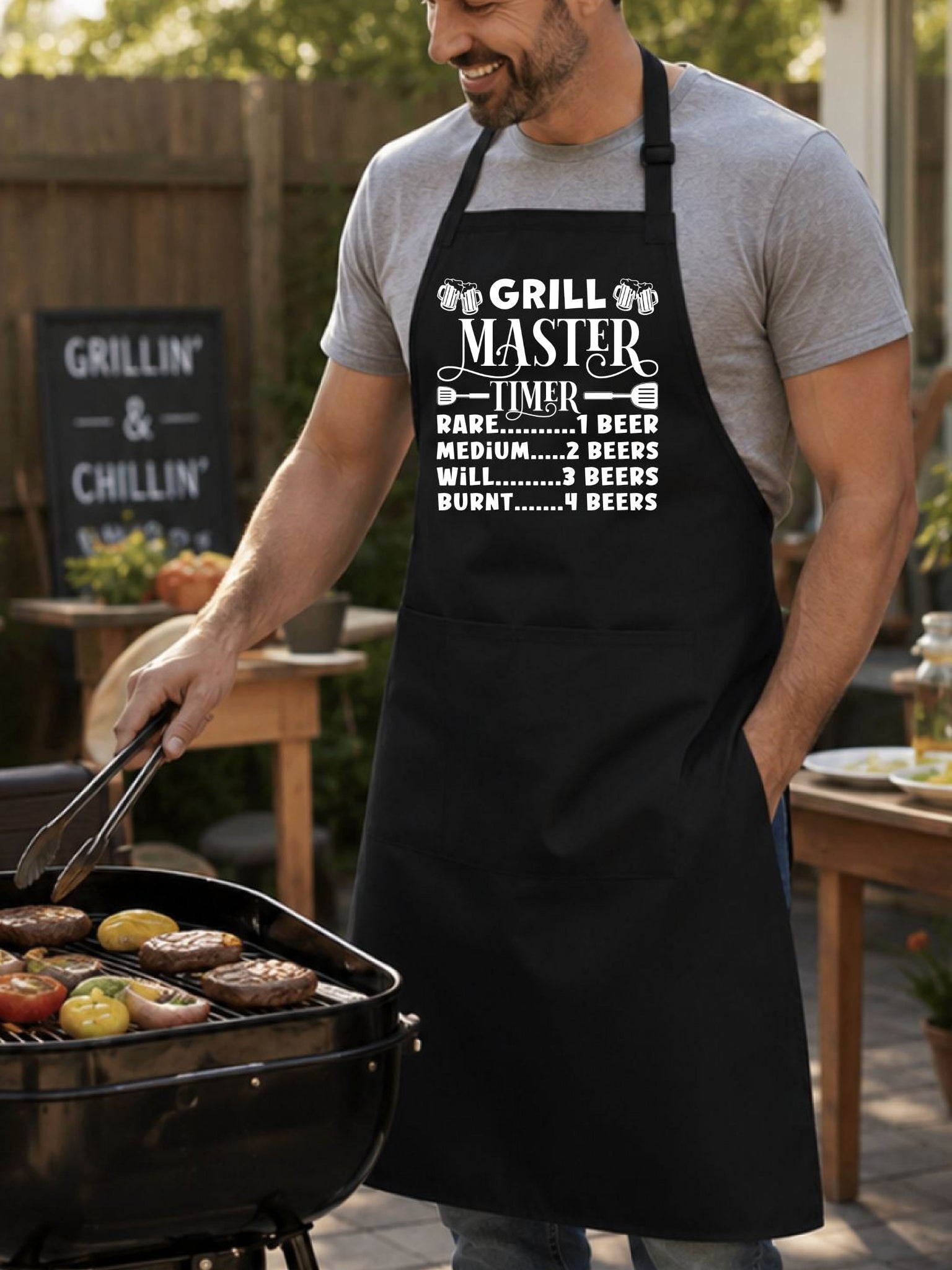 Grill Master Timer apron with funny beer and BBQ graphic design worn by man grilling burgers outdoors.