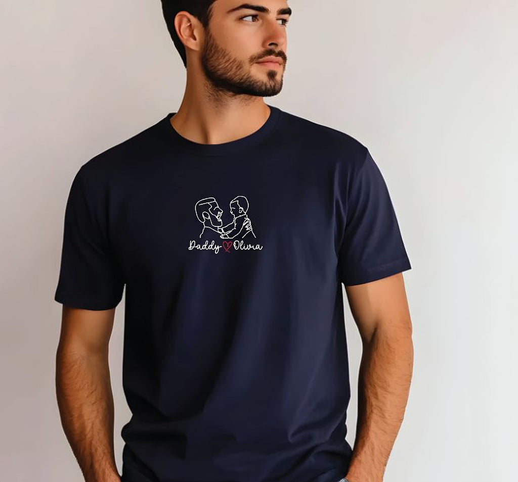 A man wearing a navy blue t-shirt with a white graphic design on it.