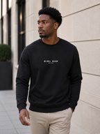 Man wearing black Girl Dad crewneck sweatshirt outdoors