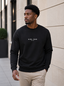 Man wearing black Girl Dad crewneck sweatshirt outdoors