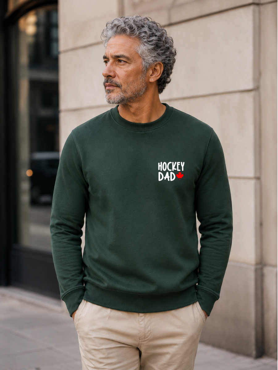 Hockey Dad crewneck sweatshirt featuring a minimalist white Hockey Dad design with a red Canadian maple leaf, modeled outdoors.