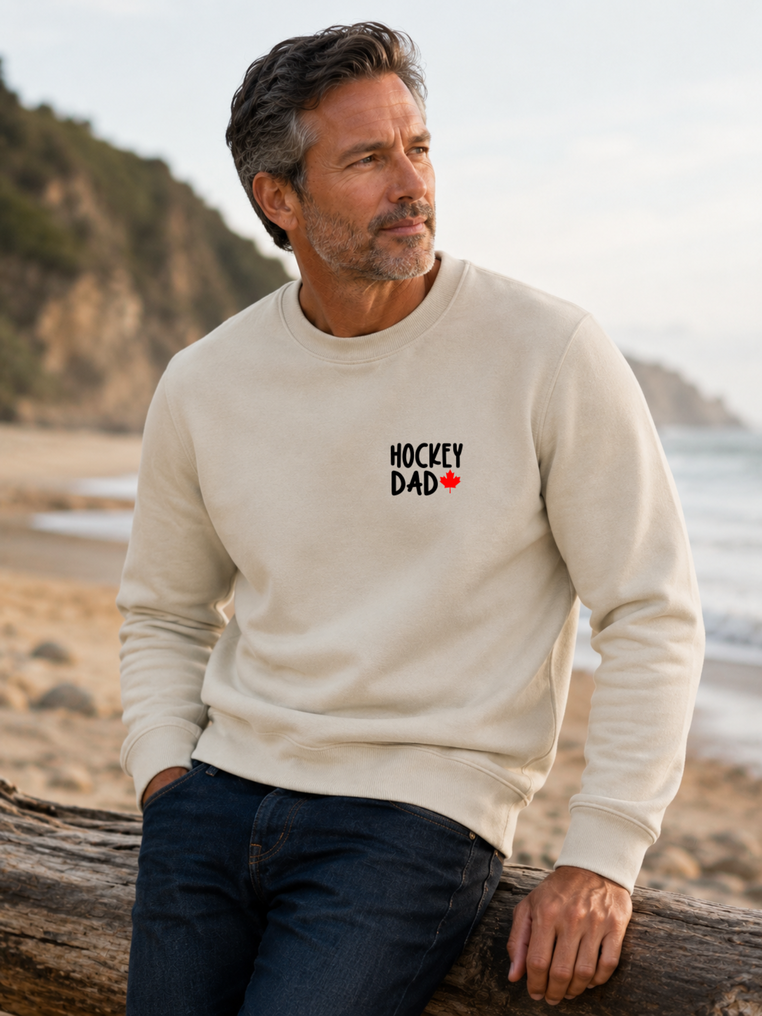 Hockey Dad crewneck sweatshirt featuring a minimalist white Hockey Dad design with a red Canadian maple leaf, modeled outdoors.