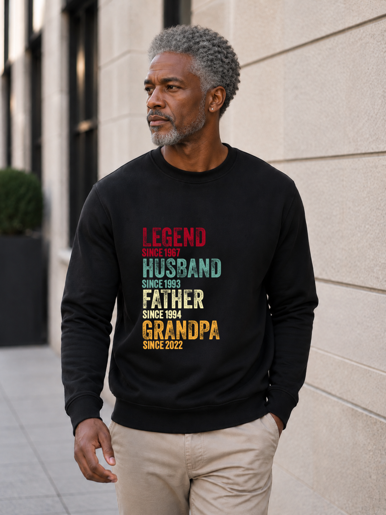 personalized Legend Husband Father Grandpa sweatshirt with vintage distressed typography and custom years worn by mature male model outdoors.